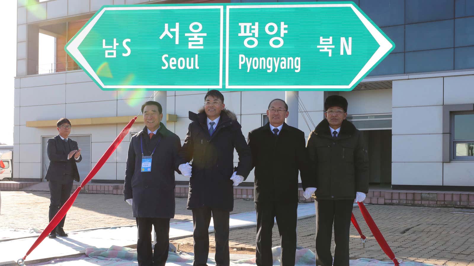 South and North Korean officials unveil the Seoul to Pyeongyang railway sign.