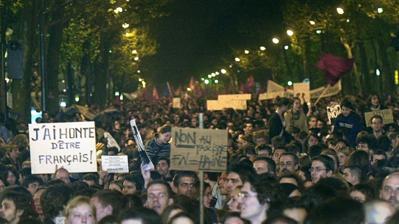The night of Jean-Marie Le Pen’s shock success in 2002, thousands were on the streets of Paris. The sign on the right reads: “No to fascism. The Front National=Hatred.”