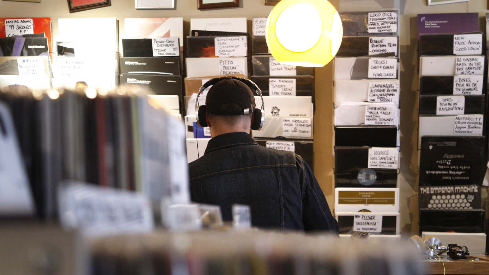 A man listens to music in the Phonica record store on Record Store Day, in central London April 18, 2009. The day aimed to celebrate…