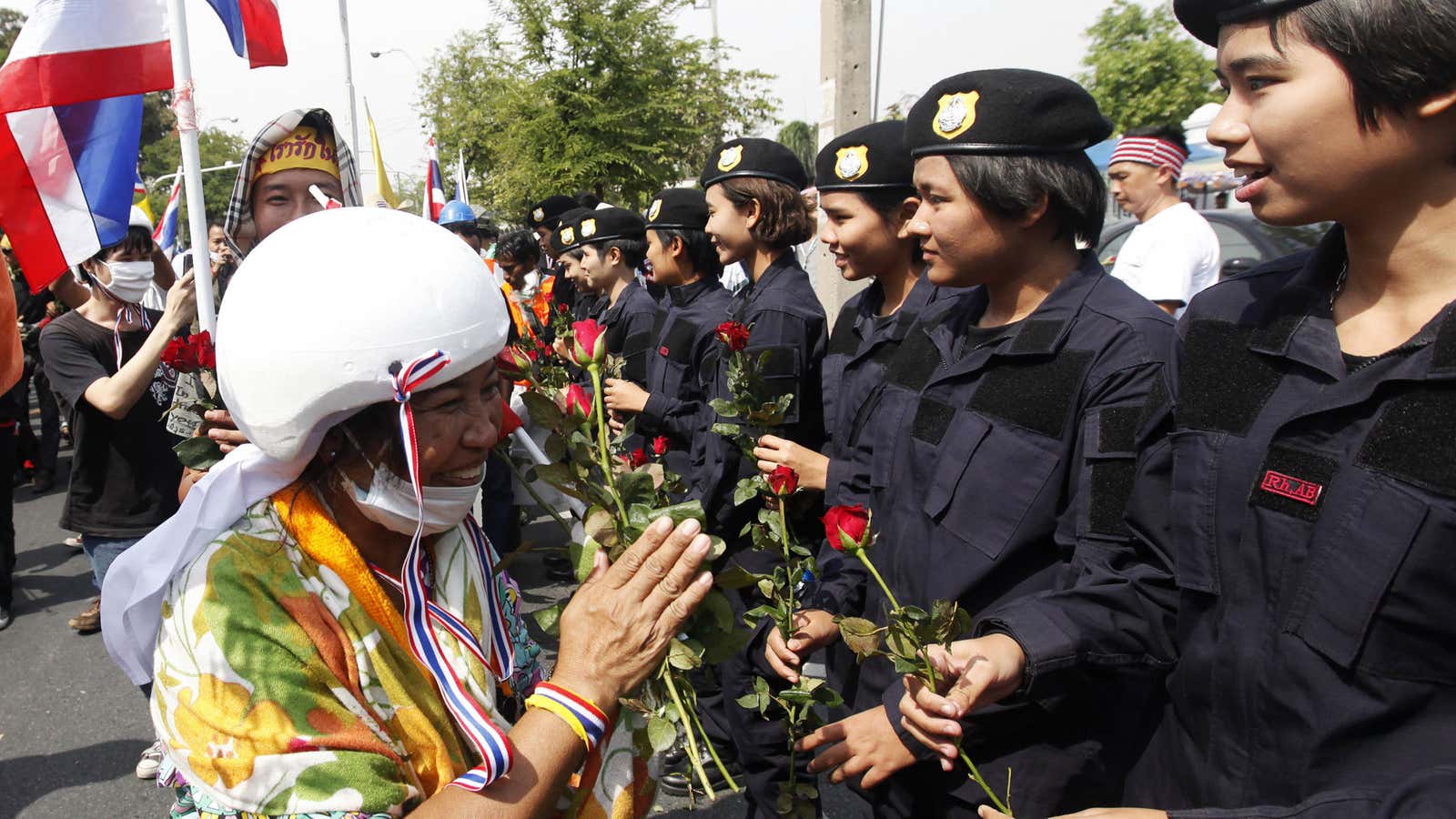 No harm no foul: protesters and police exchanging roses in Bangkok