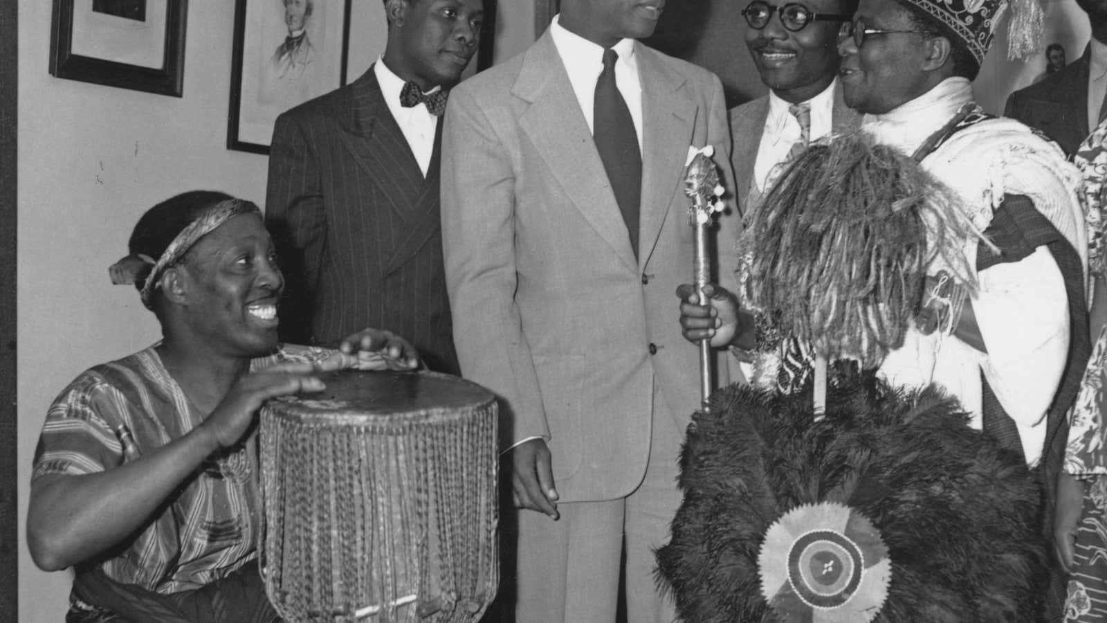 Ghana’s Kwame Nkrumah is greeted by drummer Alf Payne (left) and Nigerian activist Ladipo Solanke (right) at a meeting of the West African Students Union in London in 1951.