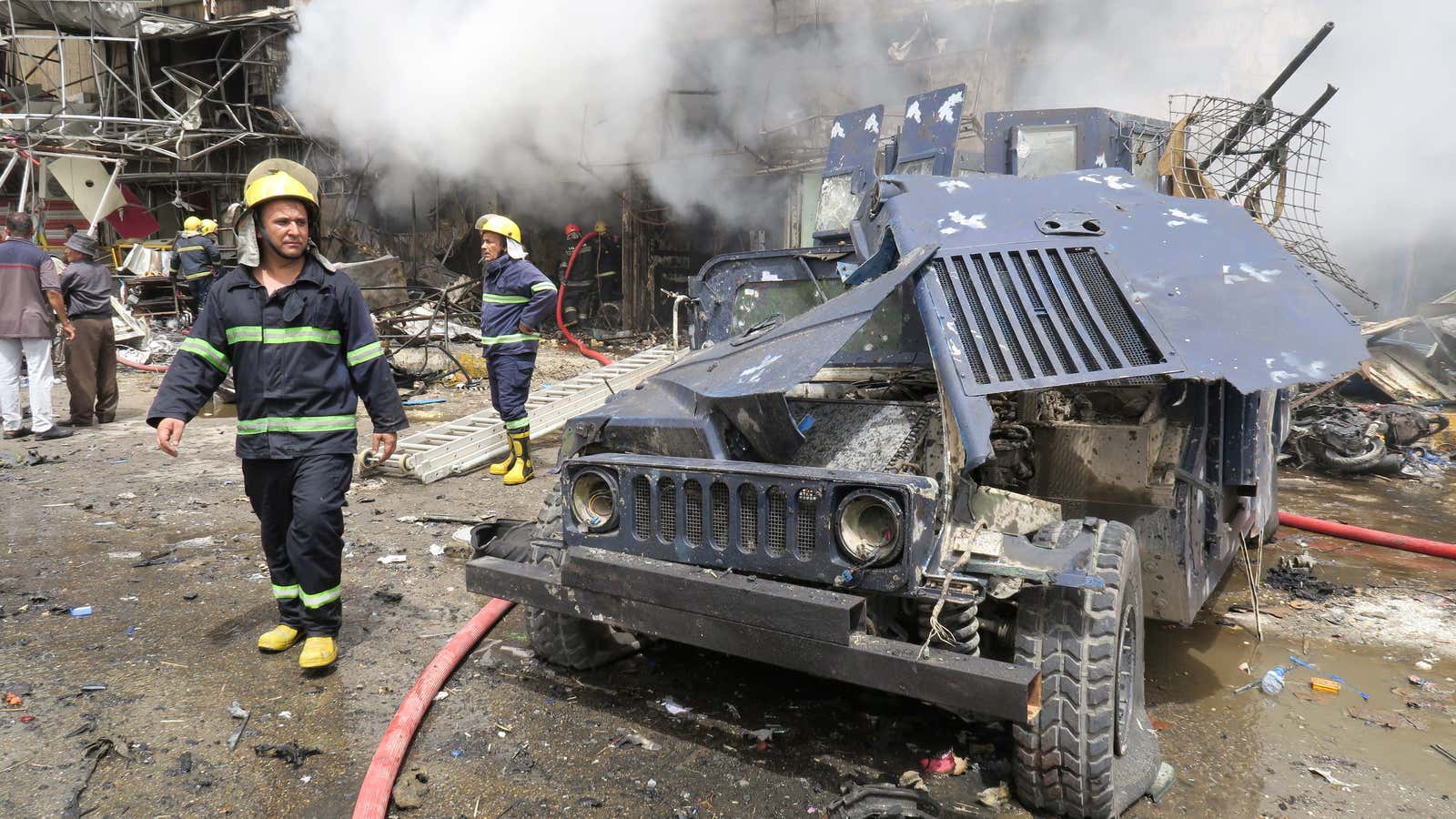 A damaged vehicle of the Iraqi security forces is seen at the site of a car bomb attack in Baghdad last month.