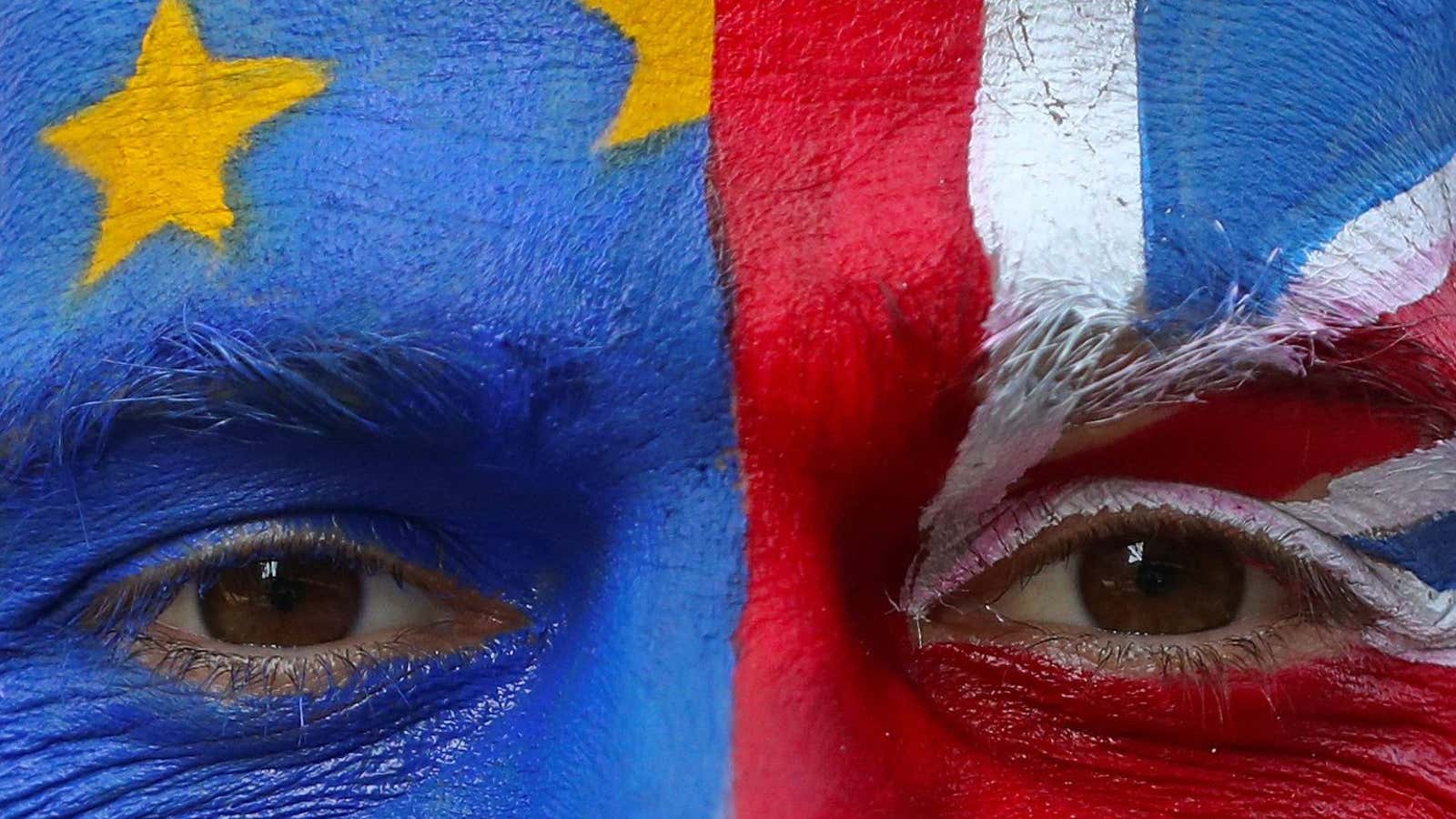 An anti-Brexit protester with painted EU and British flags on his face is seen ahead of a EU Summit in front of European Commission headquarters…