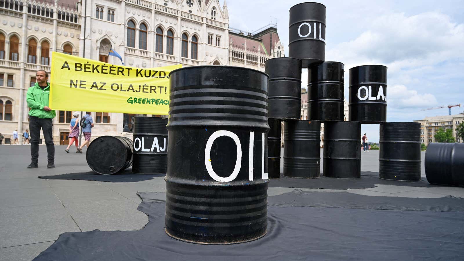 Oil barrels are seen during a protest action of independent global campaigning network Greenpeace in front of the parliament building in Budapest, Hungary on May 30, 2022