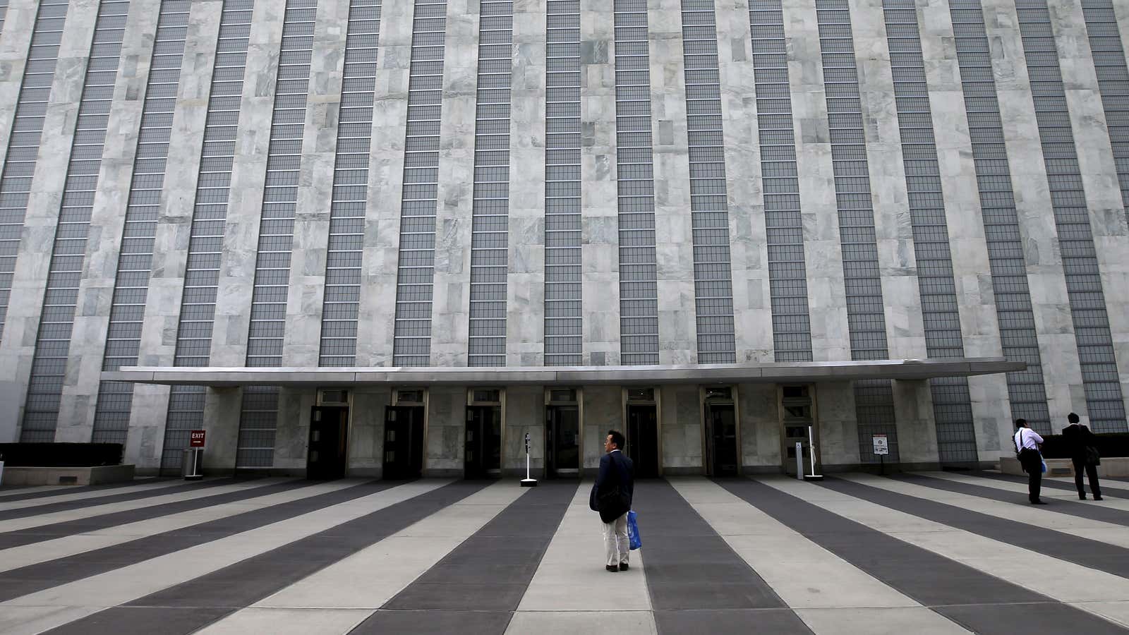 A man pauses outside the entrance to the Assembly Building at the United Nations headquarters in New York City, September 21, 2015. As leaders from…