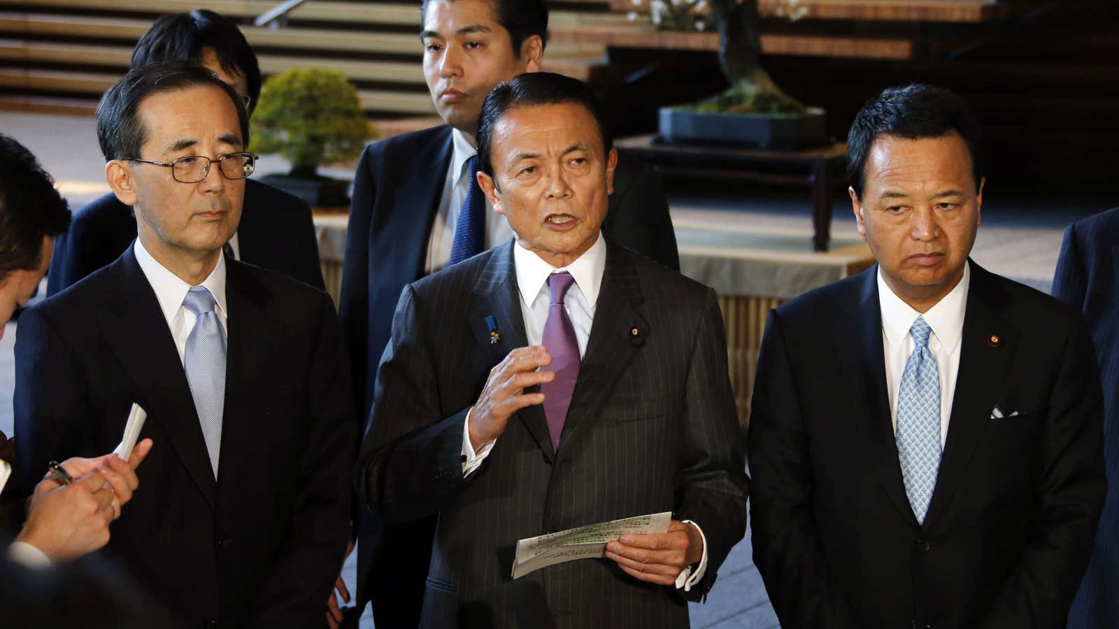 Not so radical: Japan’s Finance Minister Taro Aso (center), along with Economics Minister Akira Amari (right) and Bank of Japan Gov. Masaaki Shirakawa (left)