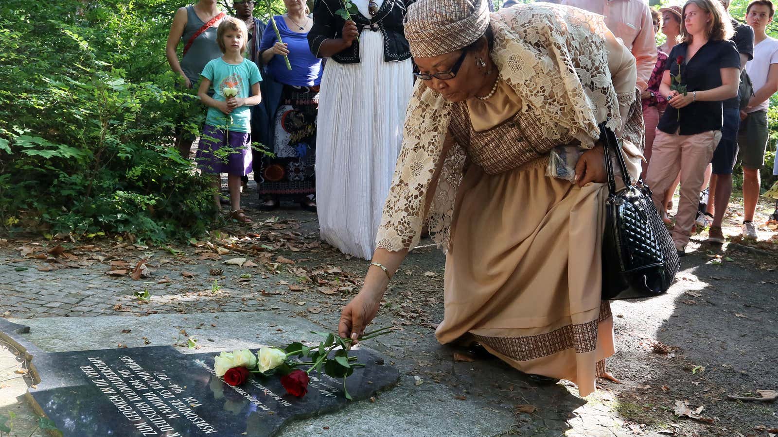 Ida Hoffmann of the Nama Genozide Technical Committee lays a flower to commemorate the victims of the German colonial rule in Namibia in the Garnisons cemetery in Berlin, Germany, 07 July 2015.