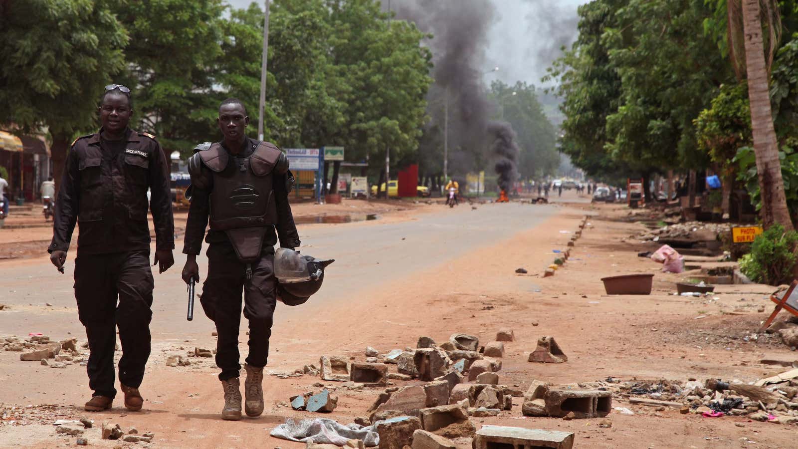 Police survey the scene after a protest, in Bamako, Mali on Aug. 17.