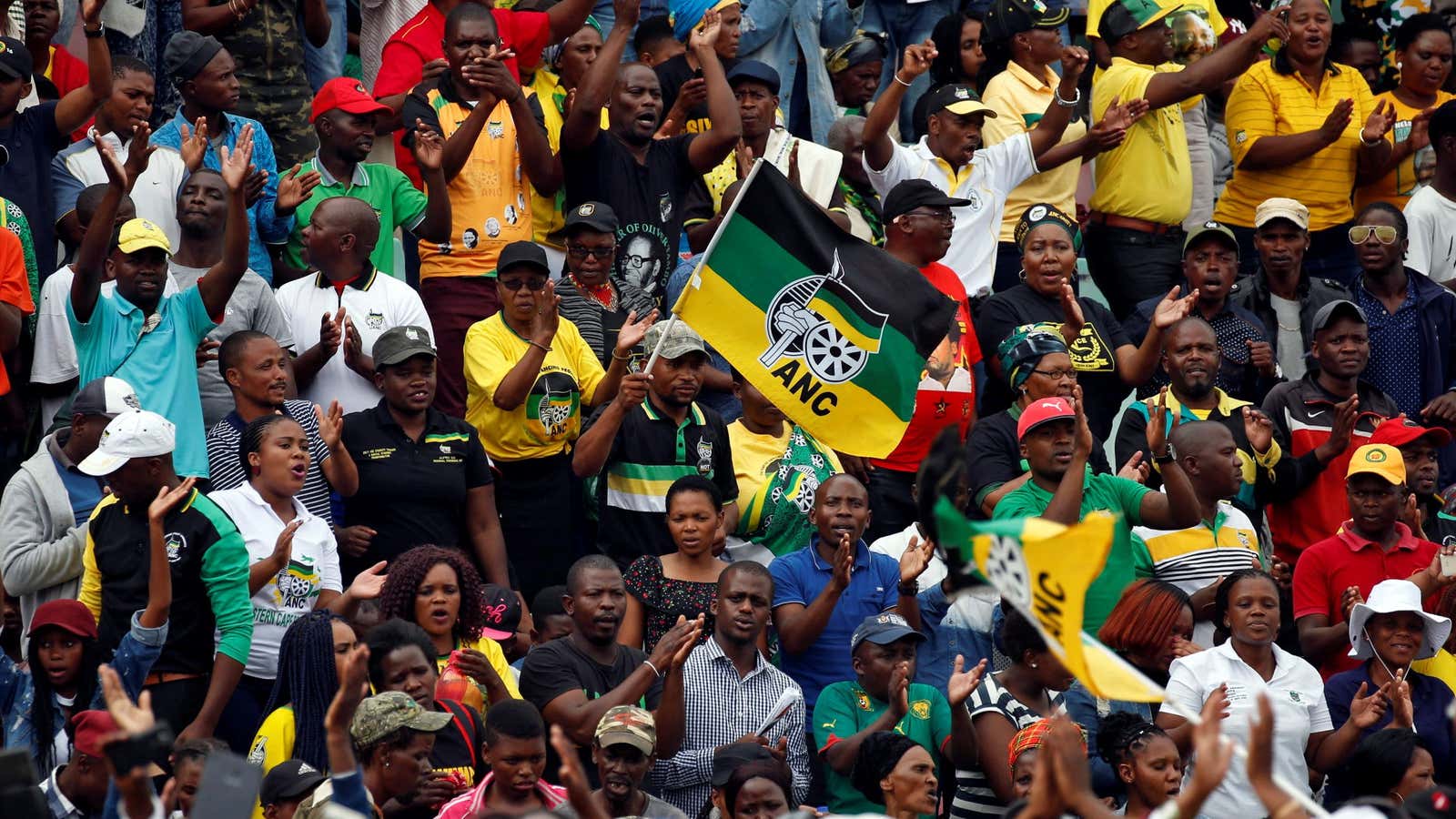 Supporters of the ANC wave a flag during the party’s 106th anniversary celebrations, in East London, South Africa, January 13, 2018.
