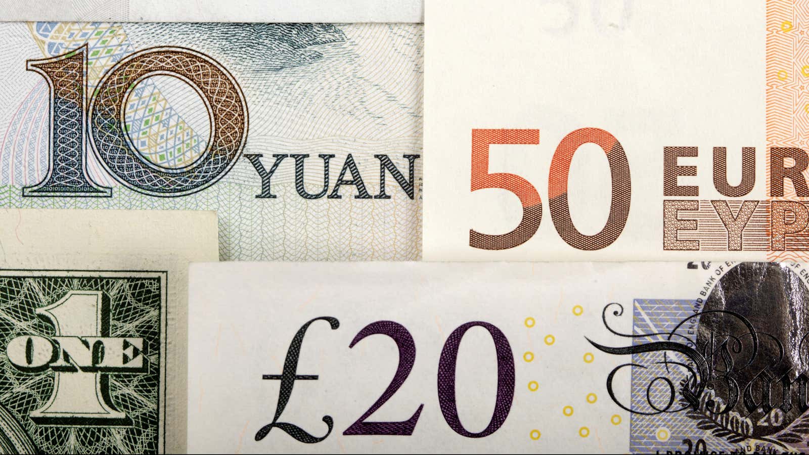 Arrangement of various world currencies including Chinese Yuan, US Dollar, Euro, British Pound, shot January 25, 2011. REUTERS/Kacper Pempel/Illustration/File Photo