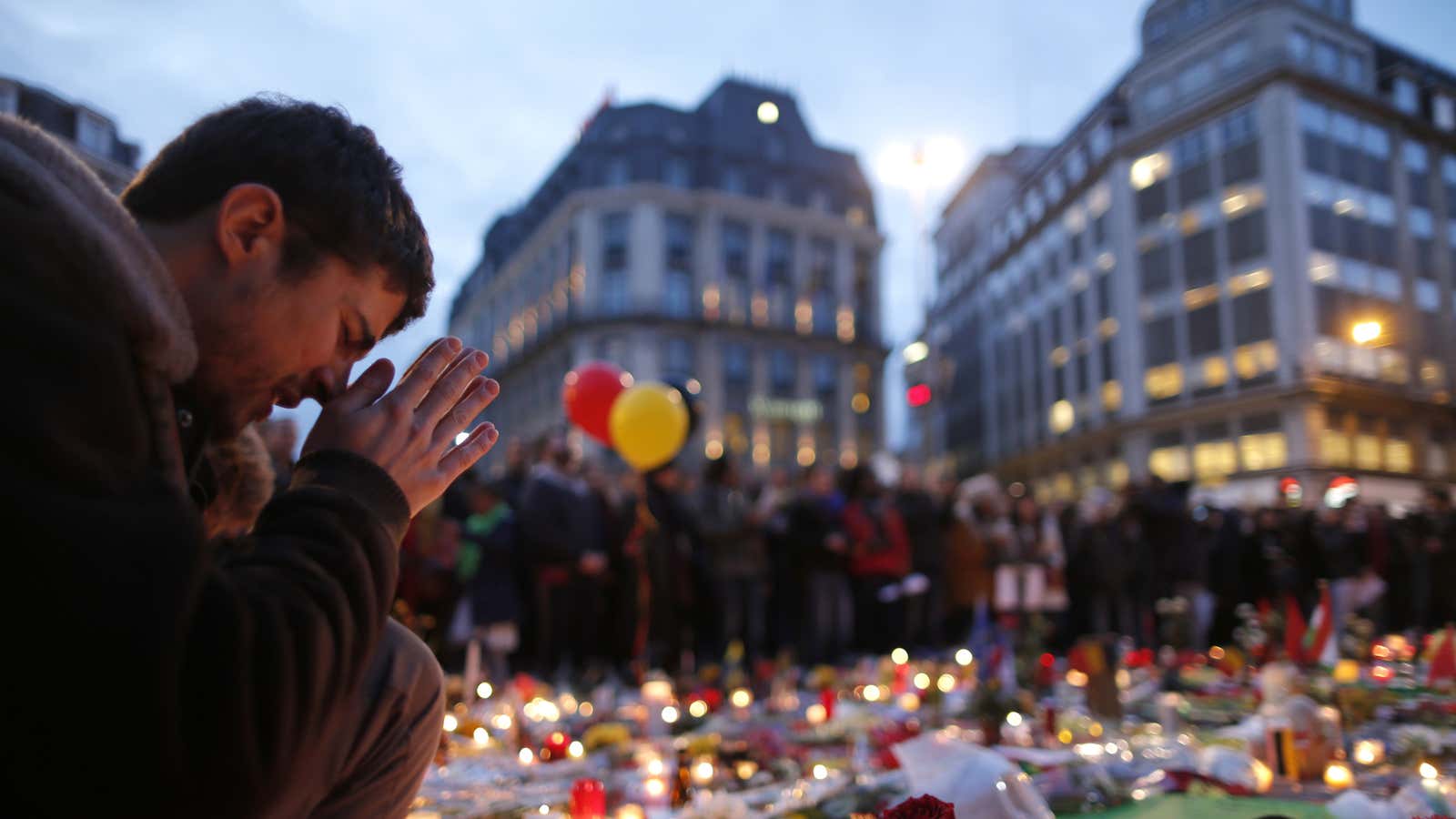 A man attends a memorial gathering near the old stock exchange in Brussels following Tuesday’s bomb attacks in Brussels.