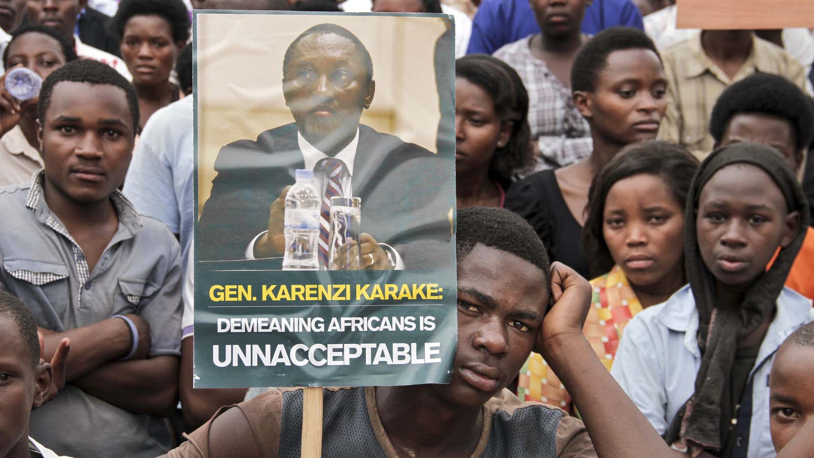 Rwandan demonstrators march to the British High Commission in Kigali to protest the arrest of Rwandan general Emmanuel Karenzi Karake.