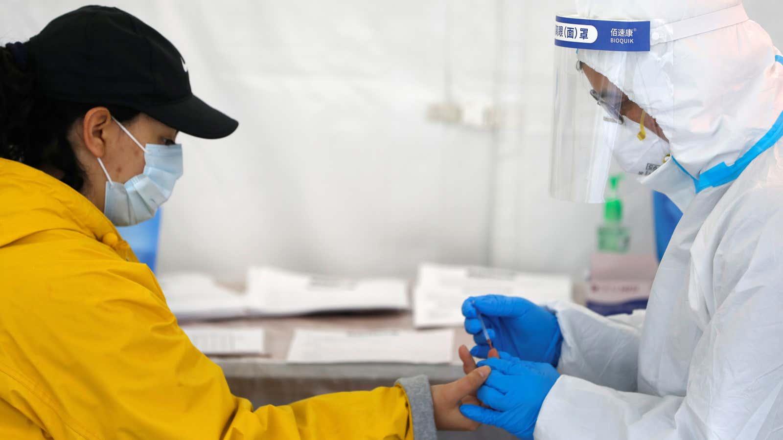 A healthcare worker performs a coronavirus antibody test at a clinic in Brooklyn.