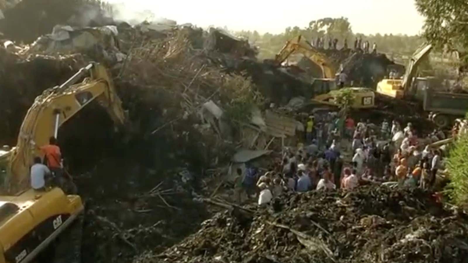 Excavators work a collapsed landfill on the outskirts of Addis Ababa.