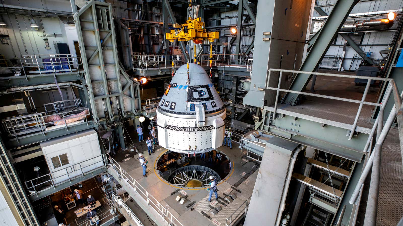 Boeing’s Starliner is attached to an Atlas V rocket before a 2019 test flight.