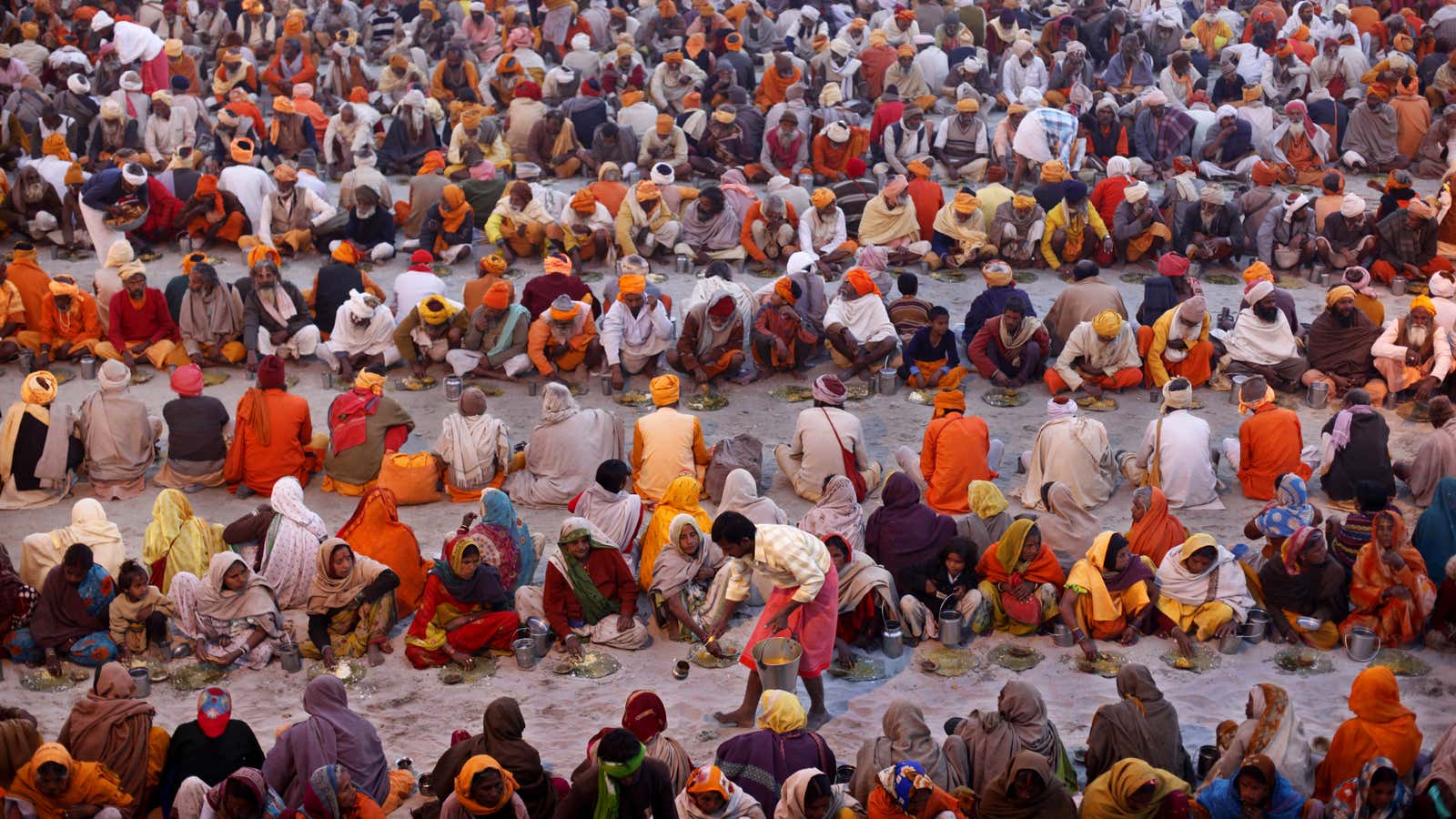 Food being distributed during the Maha Kumbh festival.