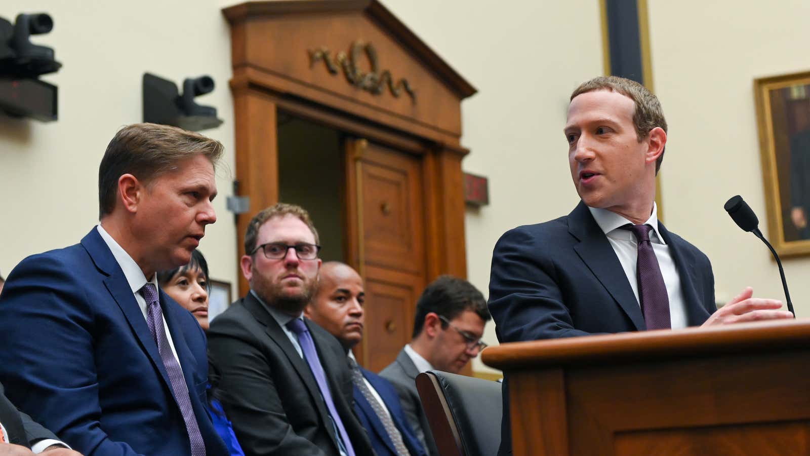 Facebook Chairman and CEO Mark Zuckerberg consults with his legal team as he testifies at a House Financial Services Committee hearing in Washington, U.S., October 23, 2019.