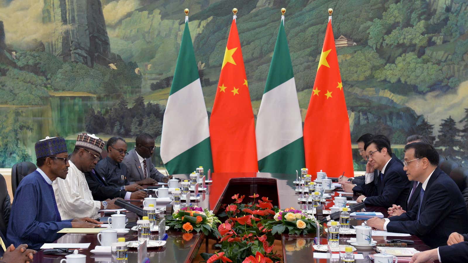 President of the Federal Republic of Nigeria, Muhammadu Buhari (L) and Chinese Premier, Li Keqiang (R) attend a meeting at the Great Hall of the…