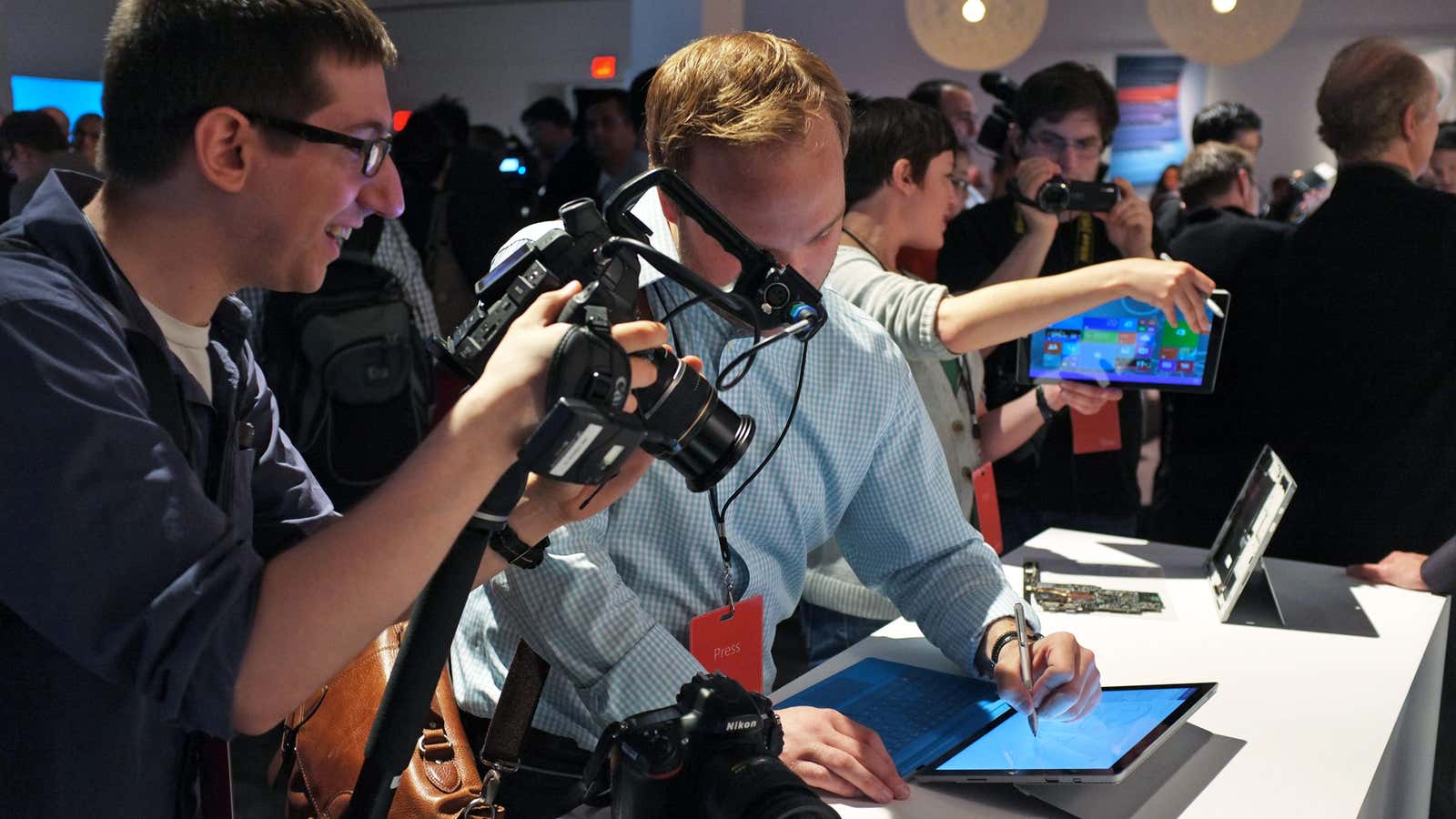 Journalists test Microsoft’s Surface 3 Pro tablet at a launch event in New York, May 20, 2014.