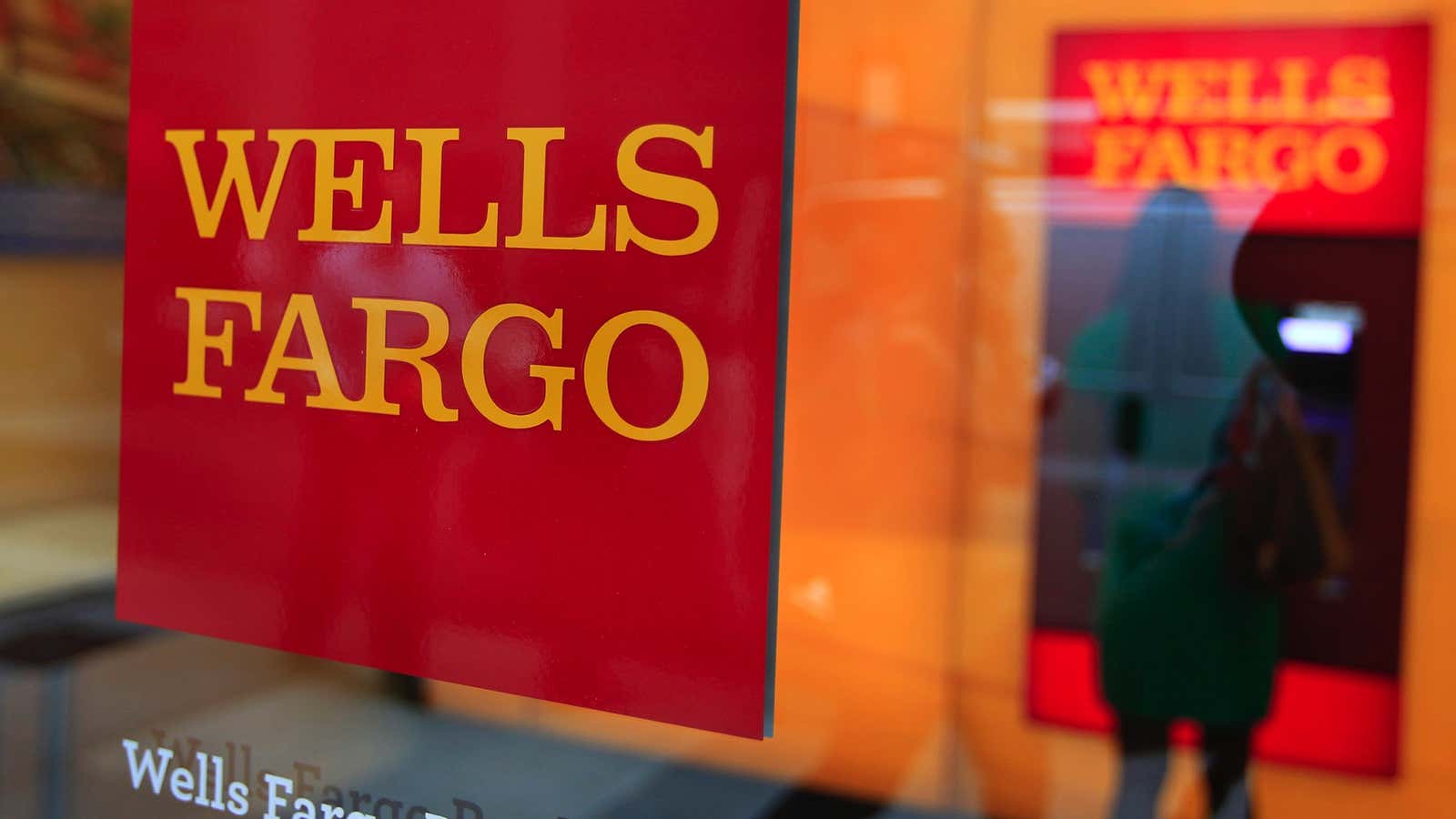 A Wells Fargo sign is seen outside a banking branch in New York July 13, 2012. Wells Fargo &amp; Co reported a 17 percent increase…