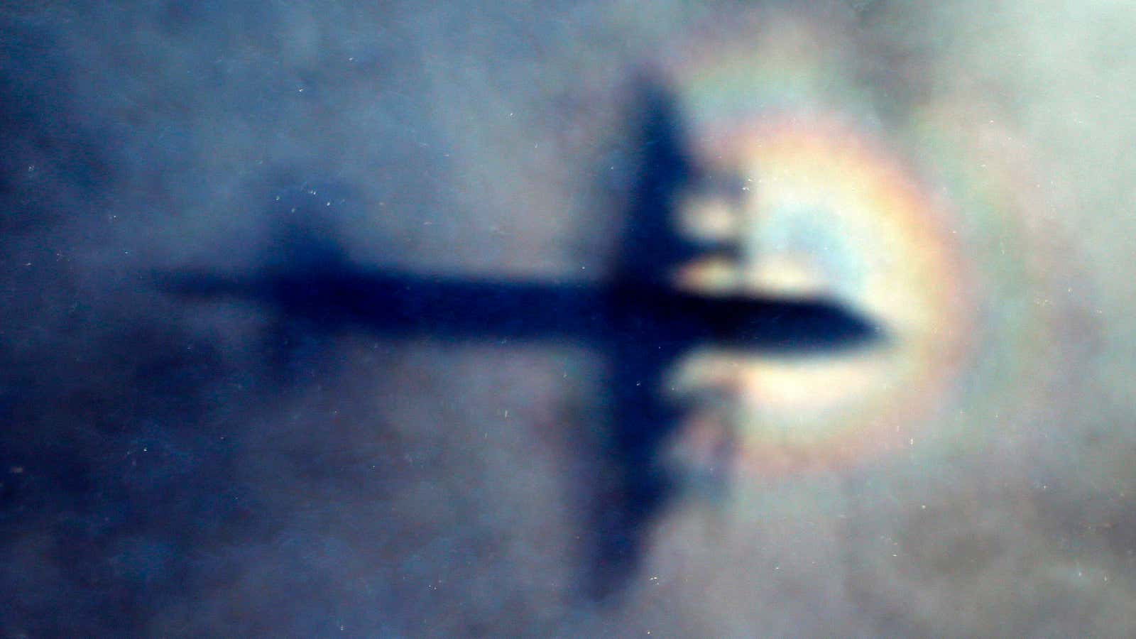 The shadow of a Royal New Zealand Air Force plane is seen as it searches for missing flight MH370 in 2014.