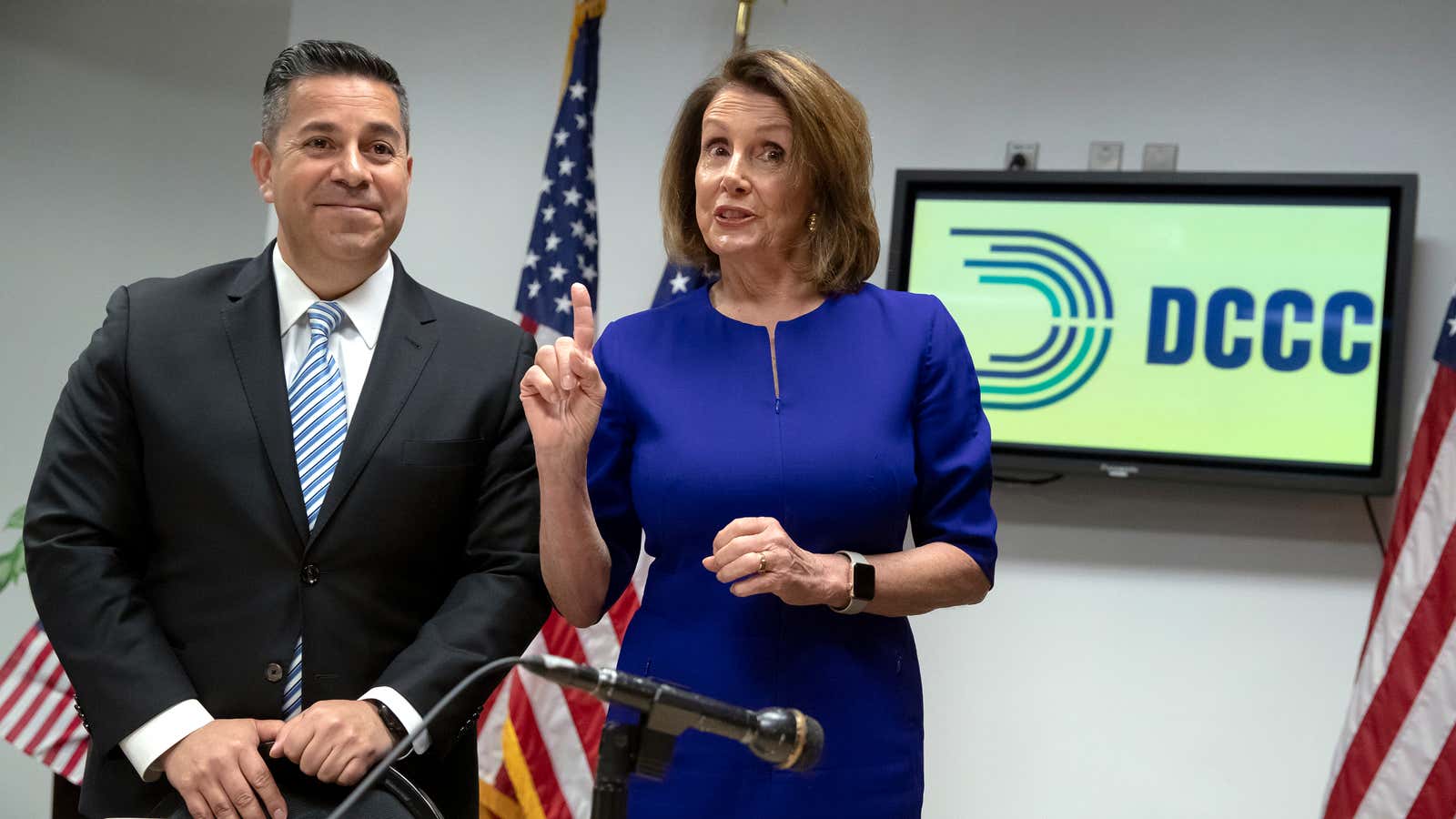 Rep. Ben Ray Lujan gets campaign pointers from minority leader Nancy Pelosi.