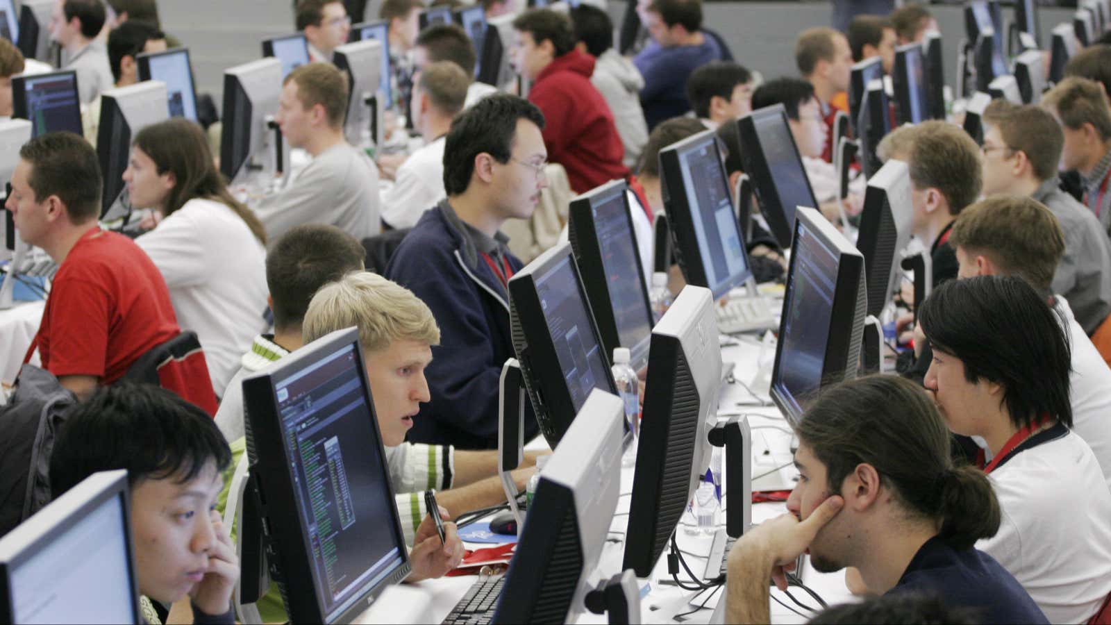 Contestants in the 2006 Google Global Code Jam stare at their computer screens at Google’s New York office Friday, Oct. 27, 2006. One hundred of…