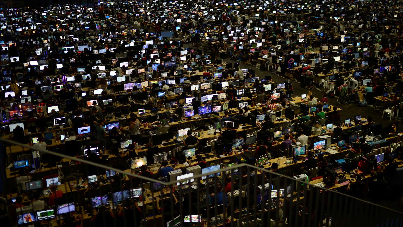 People take part in the 25th Euskal Encounter, a four-day party during which over 5,000 computers are linked via local and high speed internet connections,…