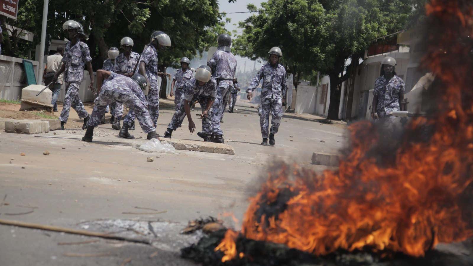 Police firing teargas to disperse protesters during Togo election in 2013.