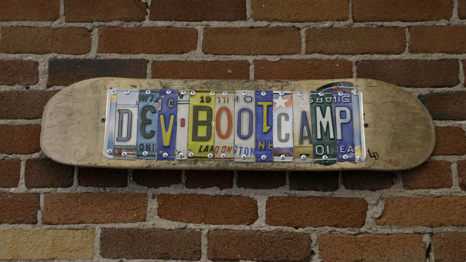 A sign for Dev Bootcamp is shown at their office in San Francisco, Tuesday, April 2, 2013. Dev Bootcamp is one of a new breed…