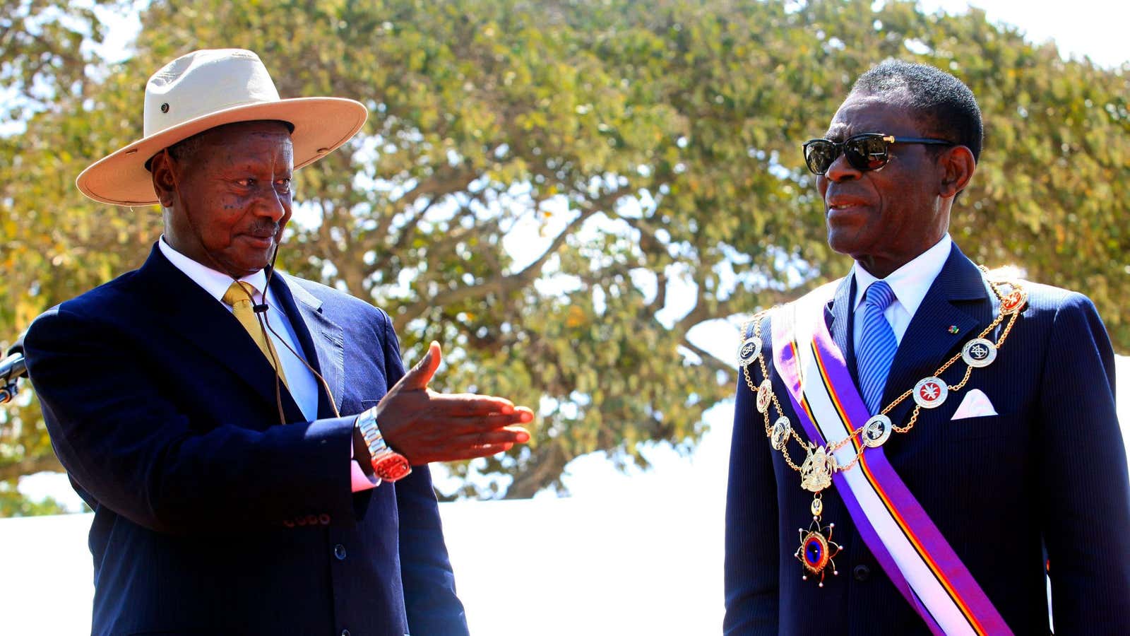 “No, no…after you.” Uganda President Yoweri Museveni (L) and Equatorial Guinea counterpart Teodoro Obiang Nguema Mbasogo