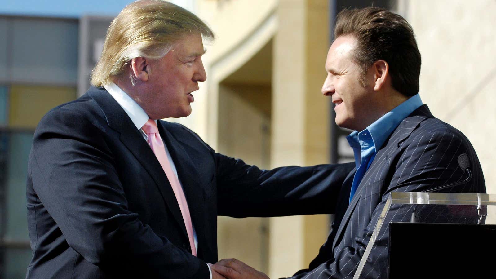 Mark Burnett congratulates then reality TV star Donald Trump in 2007.