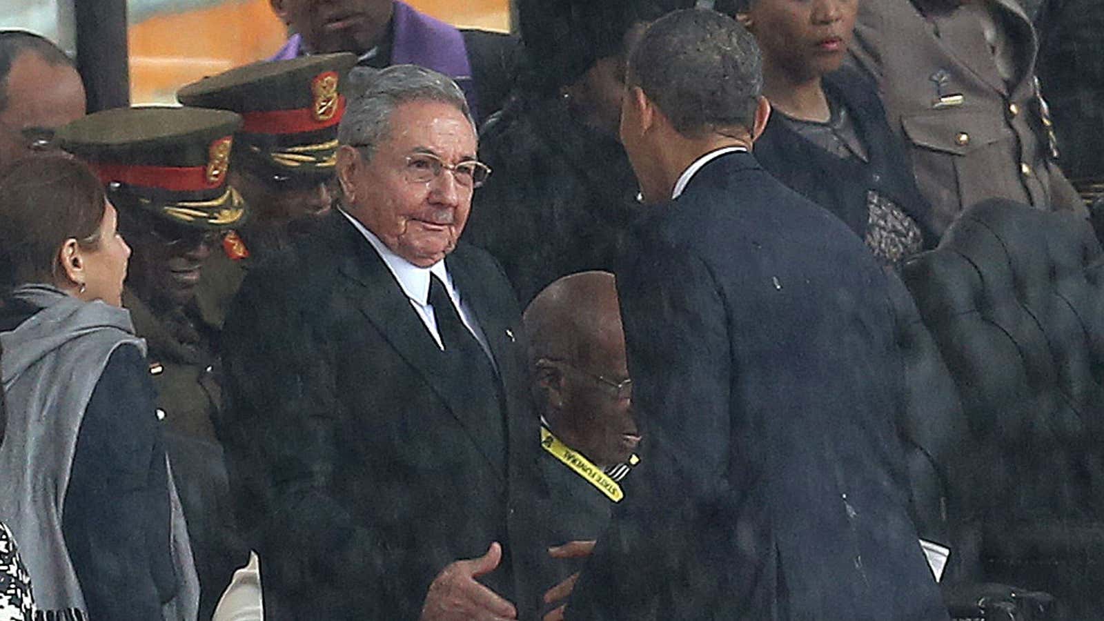 Raul Castro and Barack Obama shake hands at Nelson Mandela’s funeral.