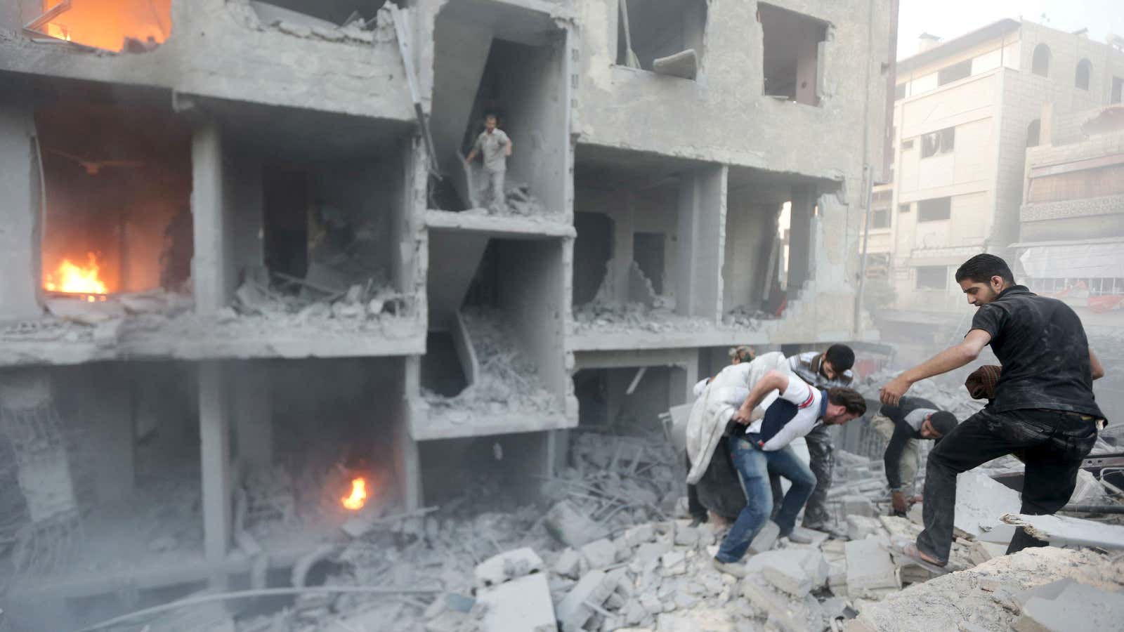 Searching for survivors after bombing by foreces loyal to Syrian president Bashar al-Assad in Damascus.