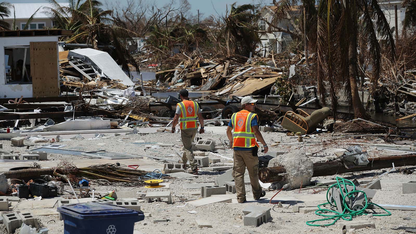 Rescue volunteers search for people in a waterfront neighborhood in Marathon, Florida hit hard by 2017&#39;s Hurricane Irma.