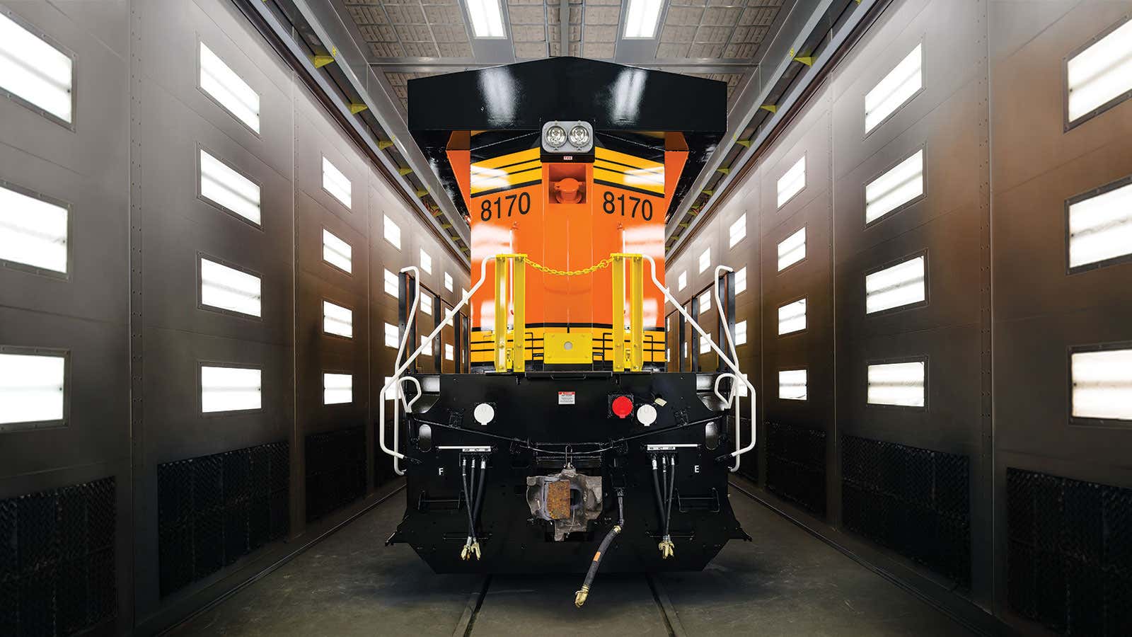 The Evolution Series Locomotive’s vivid exterior is finished in the paint room.