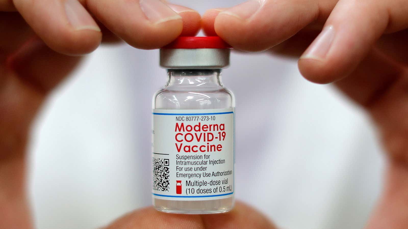 Walmart pharmacist holds a vial of the Moderna coronavirus disease (COVID-19) vaccine inside a Walmart department store in West Haven, Connecticut, U.S., February 17, 2021.