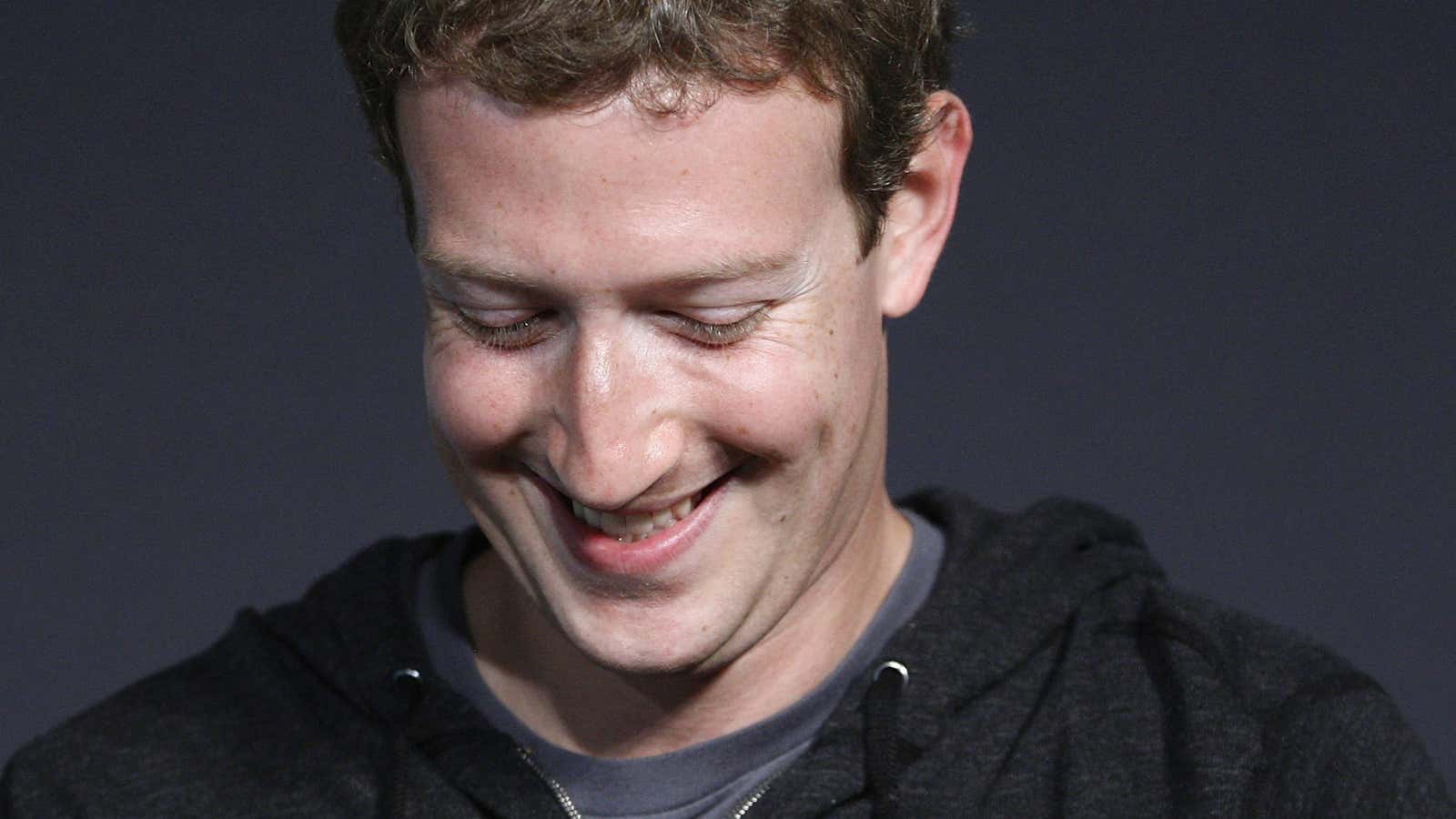 Mark Zuckerberg smiles eerily.