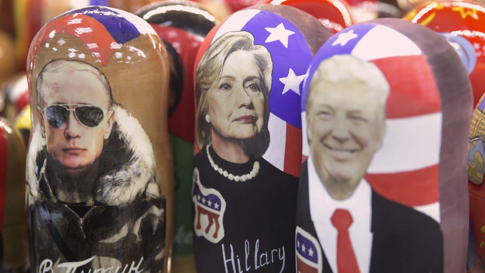 Traditional Russian wooden dolls called Matreska depicting from left, Russian president Vladimir Putin and US presidential candidates Hillary Clinton and Donald Trump are displayed in…