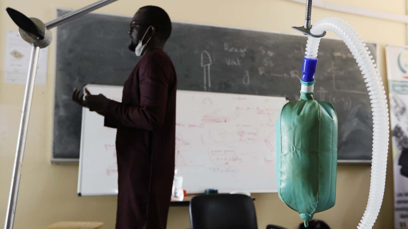 Scientist Dr Ibrahima Gueye and a prototype of a ventilator he developed with a team in Thies, Senegal
