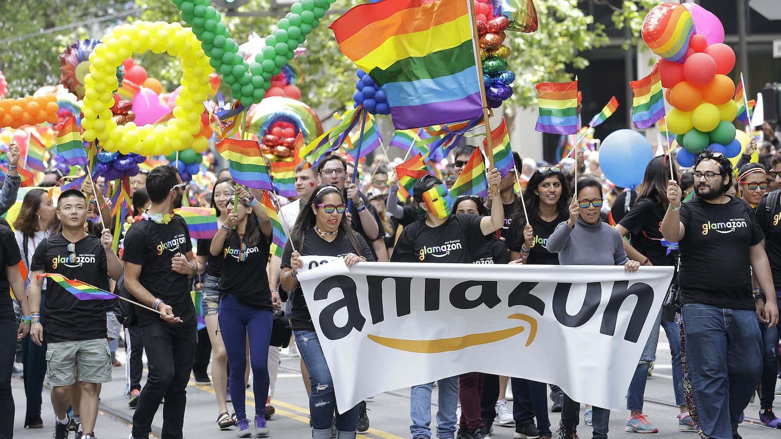 A group with Amazon marches in the Pride parade in San Francisco, Sunday, June 25, 2017.