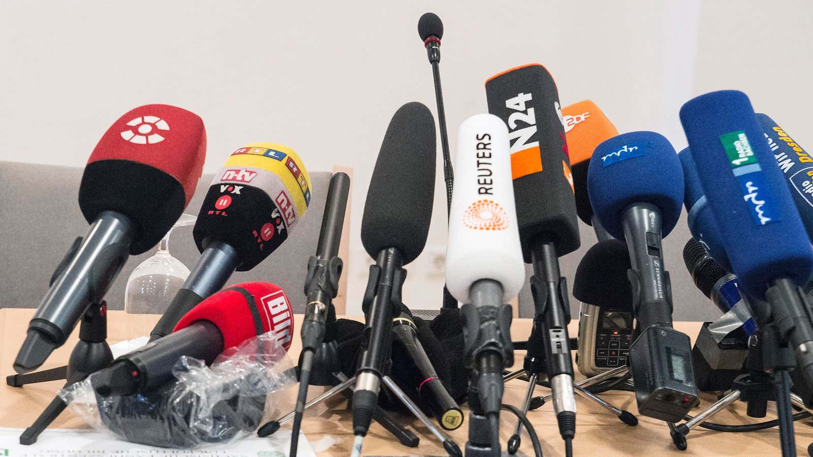 Microphones stand on a table prior a news conference of the group ‘Patriotic Europeans against the Islamization of the West’ (PEGIDA) in Dresden, Germany, Monday,…