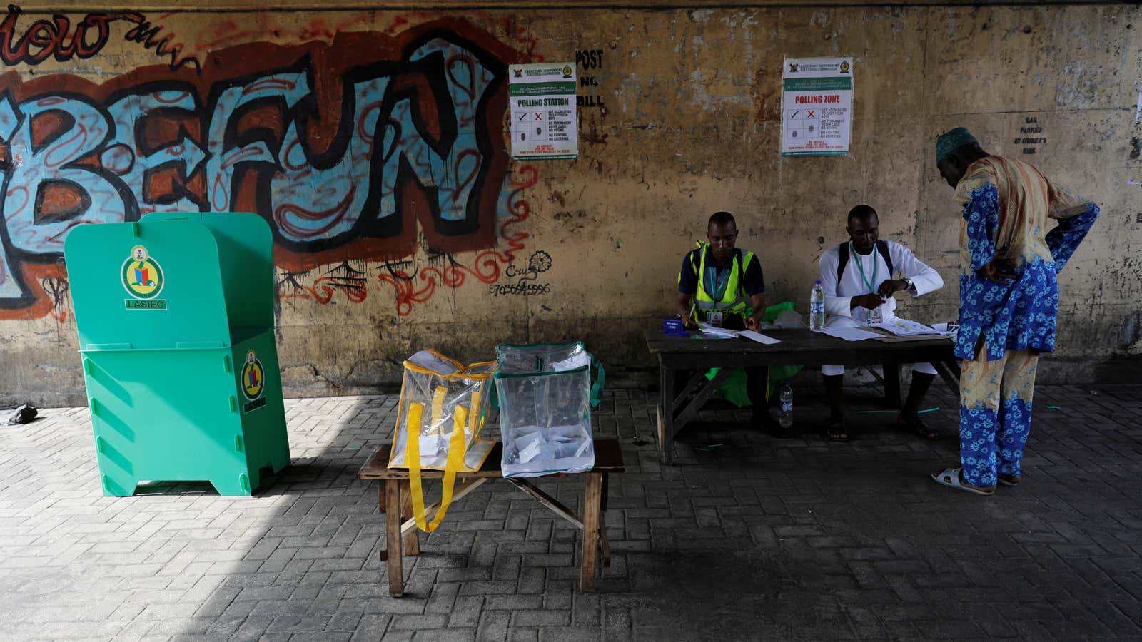 Election officials speak with a voter at the start of the local government election in Ikeja district in Lagos, Nigeria July 22, 2017.REUTERS/Akintunde Akinleye