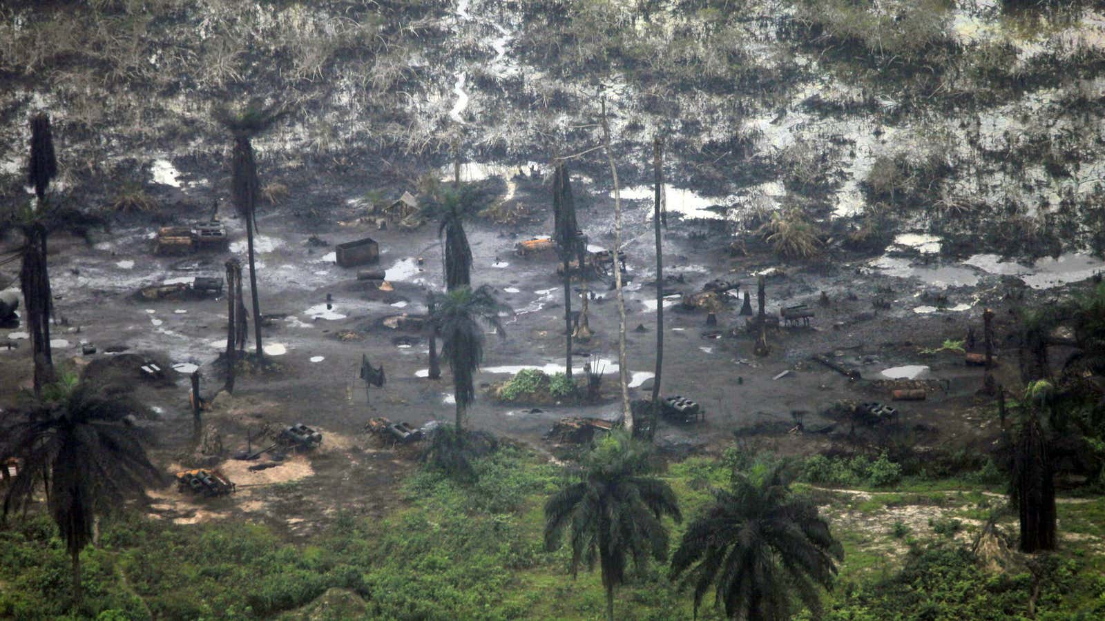 An llegal oil refinery is seen in Nigeria’s Ogoniland in 2011