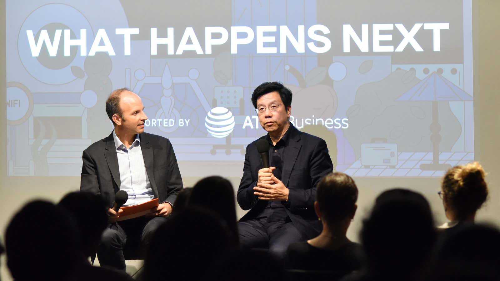 Kai-Fu Lee (right) speaks to Quartz’s Kevin Delaney at an event on Oct. 9.