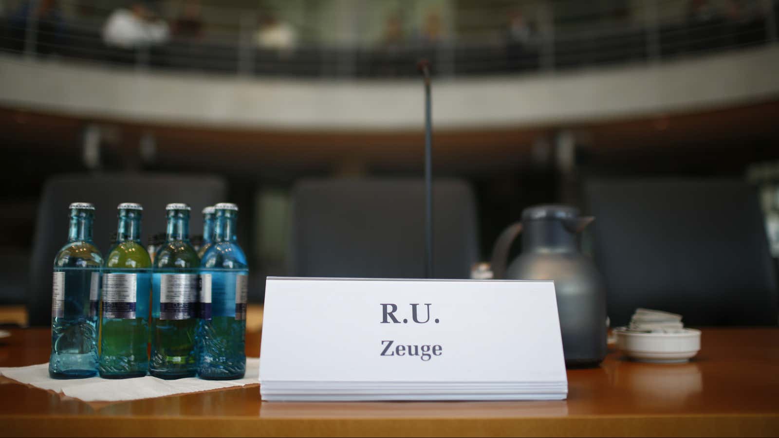 An anonymous name sign stands on the desk in front of the empty witness seat in the hearing room prior to a parliamentary inquiry investigating the NSA’s activities in Germany.