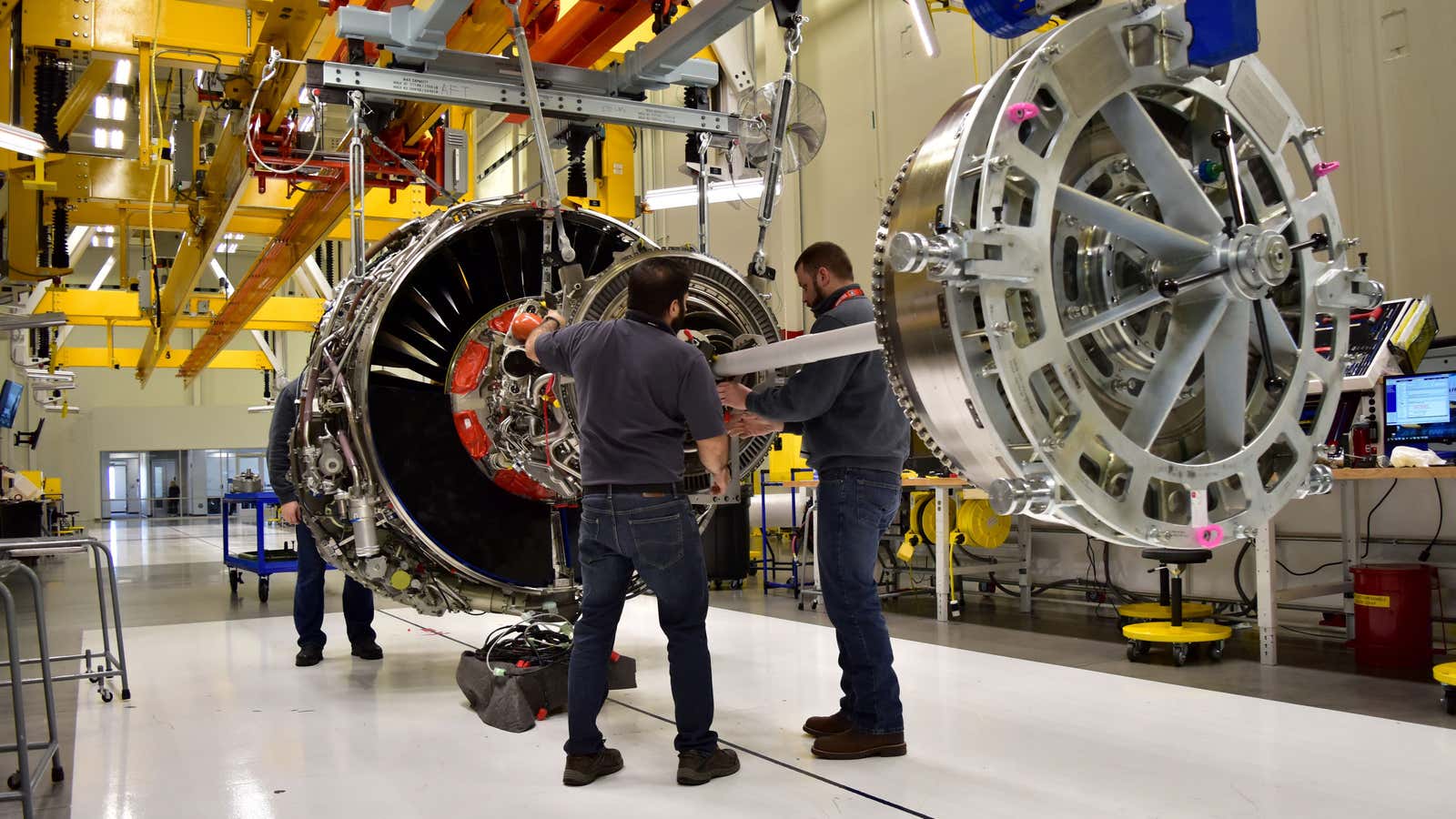 FILE PHOTO: Technicians build LEAP engines for jetliners at a new, highly automated General Electric (GE) factory in Lafayette, Indiana, U.S. on March 29, 2017.…
