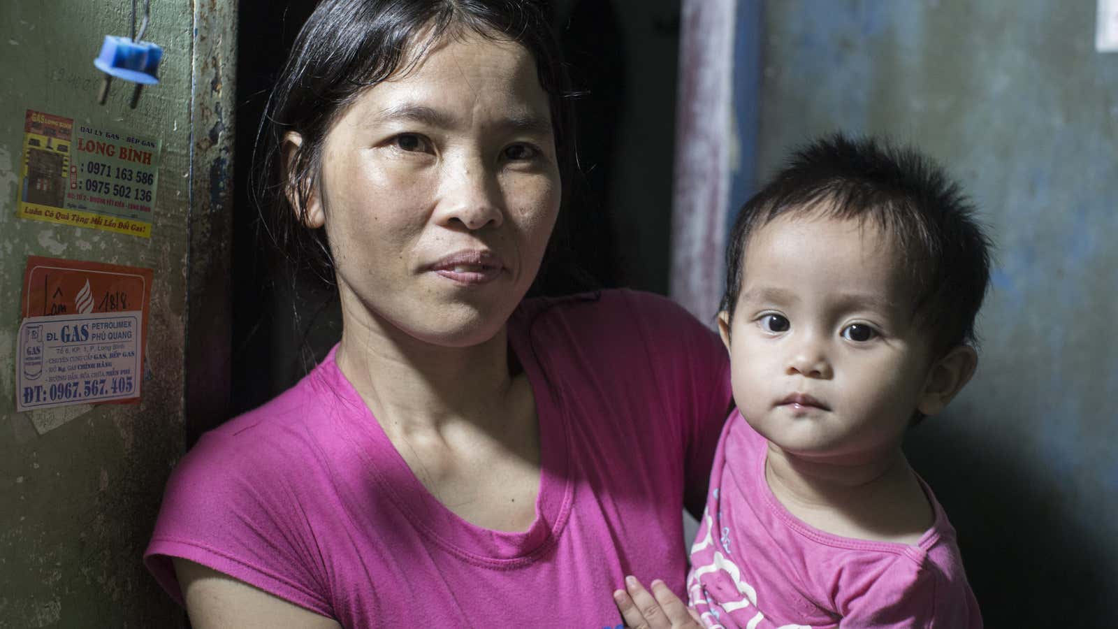 Lan, 32, and her 15-month-old daughter. Lan works in a factory in Dong Nai province, southern Vietnam, which produces shoes for global fashion brands.