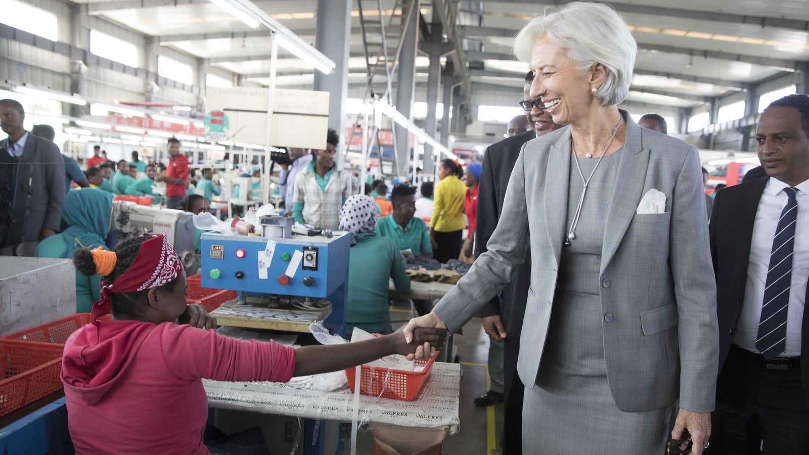 IMF managing director Christine Lagarde (2-R)  tours a shoe factory at the Eastern Industrial Park in Addis Ababa.