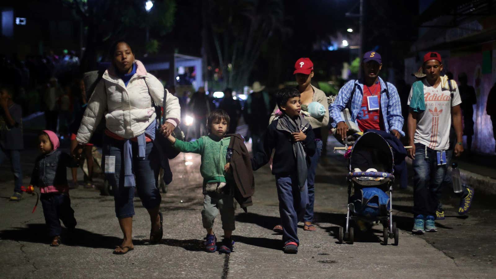 Migrants and their children en route to Mexico City.